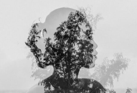 Endless Legend 2 - Silhouette of Asian woman behind tree branch near endless ocean