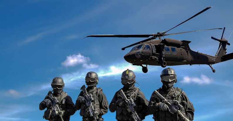 Total War - Four Soldiers Carrying Rifles Near Helicopter Under Blue Sky