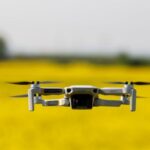 Thea 2 - A drone flying over a field of yellow flowers