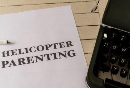 Micromanagement - A typewriter with the words helicopter parenting on it
